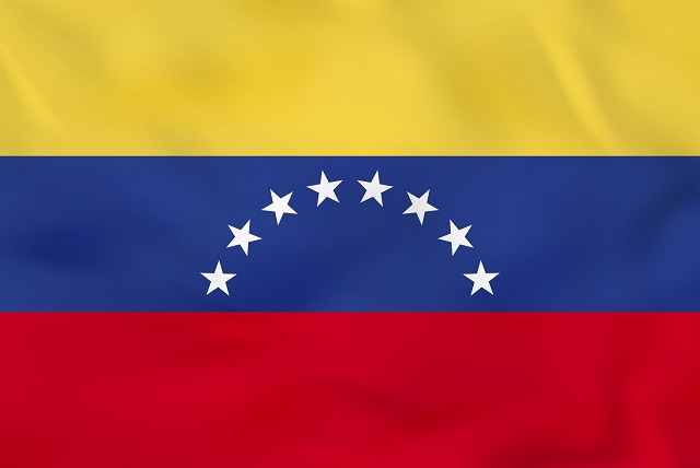 Venezuela waving flag. Venezuela national flag background texture. Vector illustration.