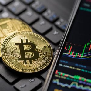 Ljubljana, Slovenia - may 12 Bitcoin gold cryptocurrency trading chart on smartphone close up.
